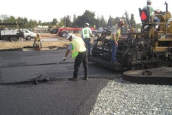 An opened-graded hot mix asphalt surface is constructed on the aggregate base. Note how the aggregate in the base is larger and more loosely compacted than a traditional base.
