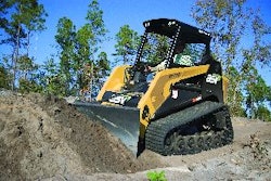 A compact track loader's tractive ability makes it well suited for use with ground-engaging attachments, such as dozer blades.