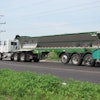 Overhead structures, such as power lines, are no longer an issue when contractors use live-bottom trailers.