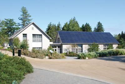 The Coastal Maine Botanical Gardens Bosarge Family Education Center produces almost 30% more energy than it is uses with 135 photovoltaic panels mounted on the south-facing roof, and an additional 102-panel array in a nearby field.