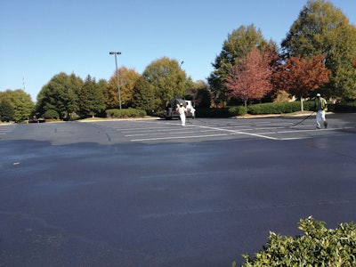 Owner Gerry Signs says that despite the weather the crews were able to complete sealcoating areas quickly enough so there was enough time for the sealer to dry between coats.