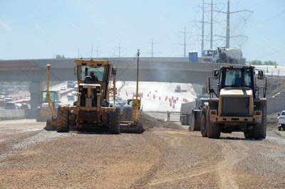 In building the road, the contractor first laid an average of 1 ft. of select granular borrow or crushed stone aggregate then a half of a foot of smaller, open graded base was placed on top.