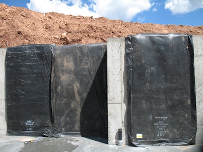 Protect concrete surfaces and corners from cold weather by ensuring all surfaces are covered.