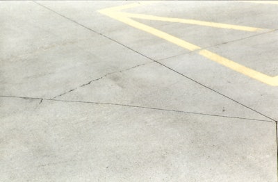 One of the rules for laying out sawed contraction joints is to not join them at angles less than 60 degrees because cracks form across the angle as shown here.