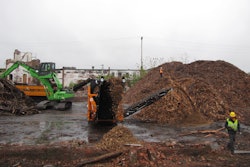 The Sennebogen 821 material handler feeds a pair of grinders as part of Costello Dismantling's efforts to maximize the revenues from demolition projects.