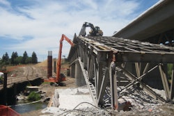 To prevent any debris from falling into the river, a protective cover was engineered to span the river and provide protection for the entire footprint of the bridge, plus 10 feet on either side of the structure.