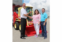 Dan Miller, CEO of Manitou Americas Inc. and President of the Compact Equipment Division hands over the keys to the Gehl R190 ‘Throwback’ sweepstakes winner Beth Hodges and her husband Robert from Indian Trail, N.C.