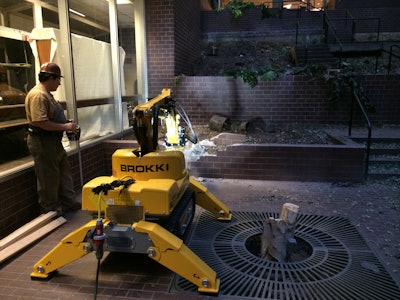 Augie Scalici of Delta BJDS demonstrates a swift demolition of a brick wall with a Brokk 100. He was able to entirely demolish the wall in 14 minutes .