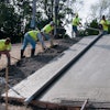 Placing pavement on steep slopes is challenging—estimating is more difficult, concrete mixes must be low slump, more labor is needed, equipment needs are different, and finishing is more complicated.