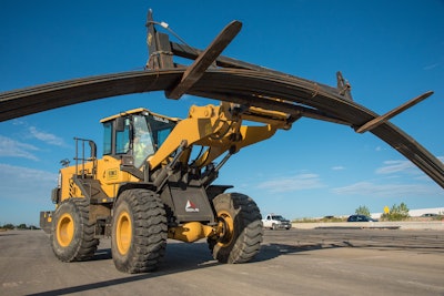 The loaders are fitted with 12-ft. forks to move 40-ft. bundles of rebar, with many of the loads weighing up to 6 tons.