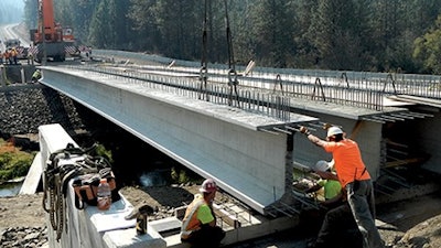 136.8-ft.-long prestressed concrete super girders for the new Miles Creston Bridge in Lincoln County, Wash., are 58 in. tall with 49-in.-wide top flanges to maximize span length, minimize the number of girders and allow clearance above the river for a 100-year flood.