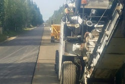 When it came time to pave the 11-ft.-wide road with 4-ft. shoulders on each side Exclusive Paving paved one lane in one direction from start to finish, then turned around and paved the same distance in the other direction, completing the paving with only one seam down the middle.