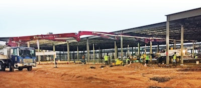 A Putzmeister boom pump and Telebelt® conveyor teamed up to place concrete for more than 25 slab pours under extremely low heights.