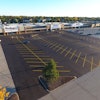 Initially the job was a mill and fill project. Asphalt Contractors had intended to just do a small patch but the inspector read the plans and determined the entire parking lot had to be milled, paved and striped before the stores could open.