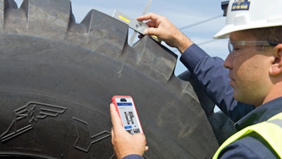 Goodyear's EM Track includes a hand-held scanning tool that tire techs use to measure inflation and tread depth. Captured data automatically uploads to the cloud for analysis.