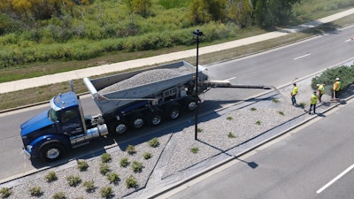 In typical stone applications, a Stone Slinger system can accurately place material up to 100 ft. from the truck. The throwing distance will be less for light-density “fluffy” materials. A shorter conveyor is also available for close-in applications such as roadway and sidewalk reconstruction in older, heart of city work.