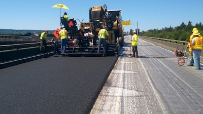 Paver laying asphalt on westbound US 2 at the Hewitt Avenue Trestle. Silver material at the bottom of the picture is the new waterproof matting that keeps rain from seeping into the bridge structure.