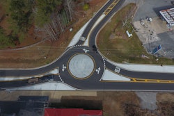 Piedmont Paving waited a state-mandated 14-day period following paving before installing thermoplastic markings. Once the thermoplastic is down they returned and addressed the shoulders and finished any grassing and grading work.