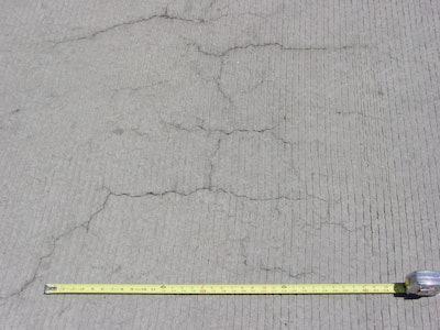 Occurring in both random and parallel patterns, plastic shrinkage cracks are discontinuous, relatively short and typically fairly shallow. Occasionally they can become full-depth cracks. Parallel cracks are typically spaced between a few inches to several feet apart and many times are oriented perpendicular to the prevailing wind direction. Cracks widths at the surface can be fairly wide (as much as 1/8 in.) but rapidly diminish with depth.