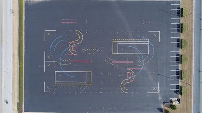 Layout of the training area started with marking the four corners of the 30,000-sq.-ft. area, creating the outlines of a rectangle. Bolts were screwed into the pavement at the four spots, and the four points were connected by a nylon baling cable, creating the outlines of a rectangle. This long sides of the rectangle served as reference points to help position markings within the test track.