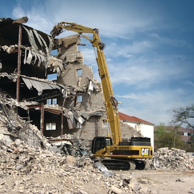 The high-reach excavator allows precise, ‘surgical’ demolition of tall structures. On some of the newer high-reach excavators, the cabs tilt backward at an angle so the operator can work without having to strain his/her neck trying to look upwards. Image source: Caterpillar
