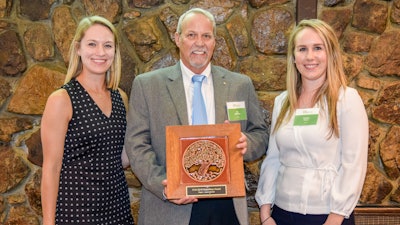 Jim Whitfield, MAPEI Corporation’s Director of Technical Services, and Brittany Storm, MAPEI Corporation’s Sustainabaility Manager, receiving the award.