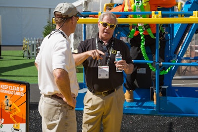 Author Tony Groat talks to a visitor at ConExpo-Con 2020.