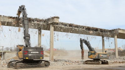 Greg Bair Track Hoe Services Inc. used a Volvo EC750E HR and a EC480D high-reach demolition excavator working side by side to demolish the two bridges in a very tight time frame.