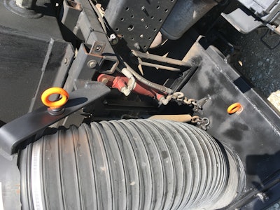 Install eye hooks on each side of the sweeper head and the broom.