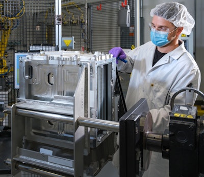 General Motors Fuel Cell Controls and Process Engineer Joe Truchan builds a fuel cell stack at the GM Global Propulsion Systems Pontiac Engineering Center in Pontiac, MI.