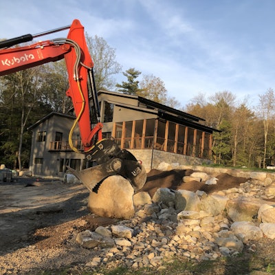 Steve Bianco, owner of Marlboro Mountain Construction, appreciates the ability to securely grab and precisely maneuver it into place using the Power Grip Bucket and Tiltrotator.