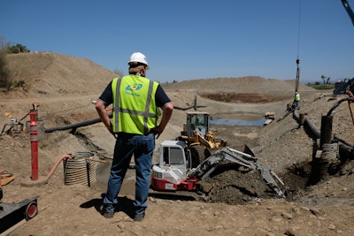 Part of temporary well dewatering involves installing the well casing or pipe into the ground to the depth required and below.