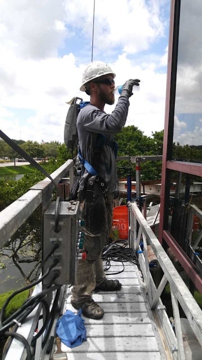 Western Specialty Contractors Worker Drinking Cold Water 60de39093891f