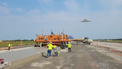 Atlantic Contracting and Material Co. Inc. were hired to pave both the Dulles International and Andrews Airforce Base at the same time. Causing them to purchase a fourth RexCon Model S concrete plant. They used a Guntert & Zimmerman S850 Quadra Bolster Concrete Slipform Paver.