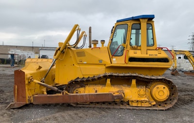 This dozer is equipped with push arm blade mounting.