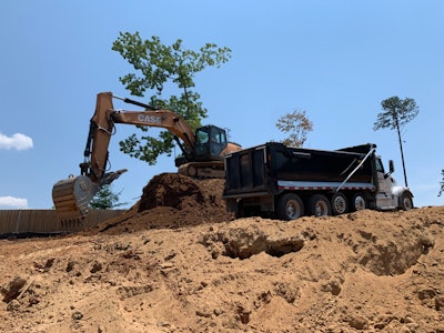 After the material was ground, a final team loaded it onto trucks using the Case 300 excavators and Werk-Brau buckets.