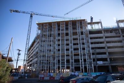 The vertical concrete elements start at ground level and extend all the way to the ninth floor.