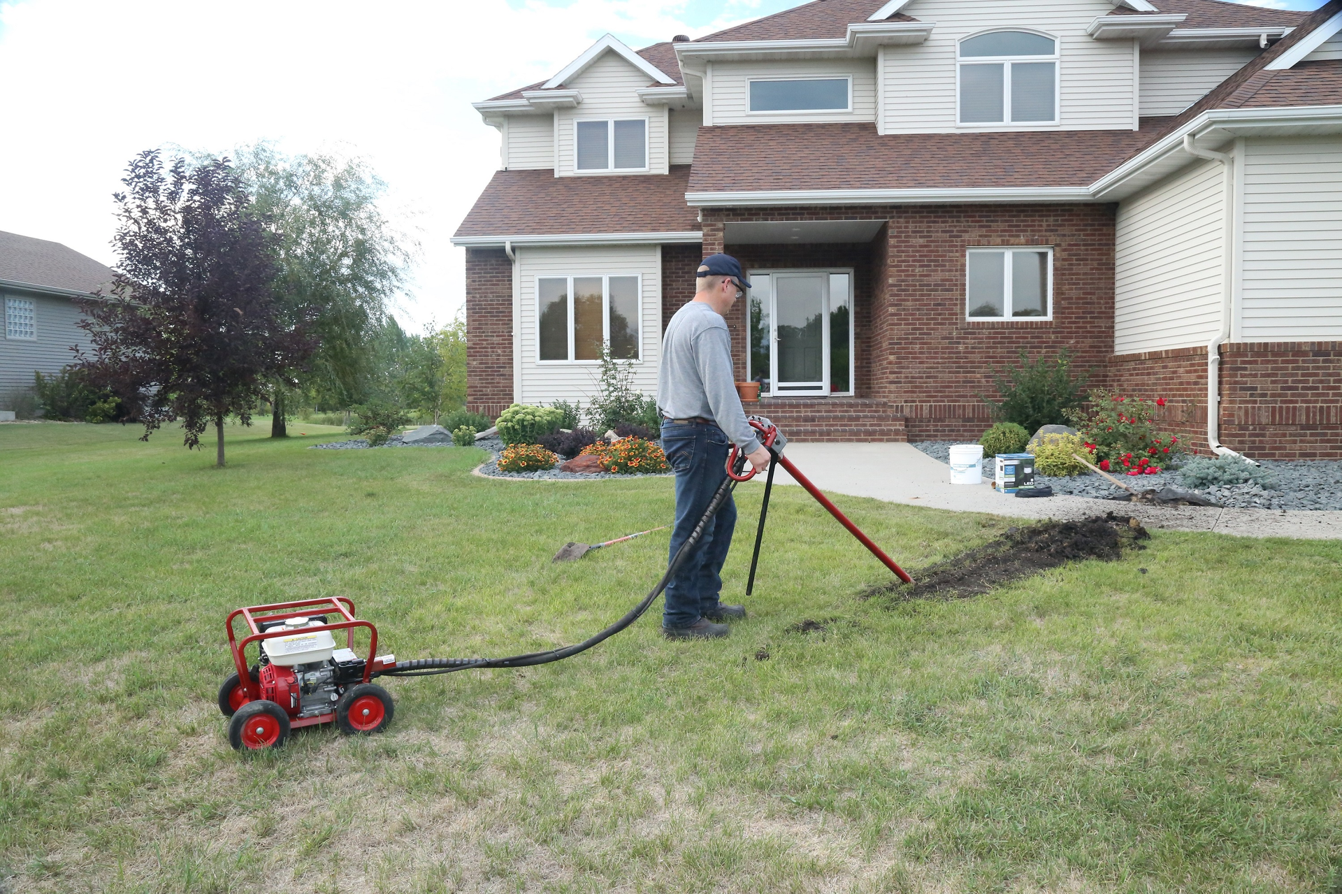 Easily bore under sidewalks or driveways by simply adding a horizontal boring attachment to a mechanical earth drill.