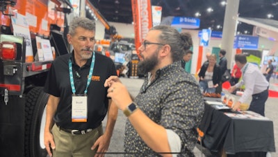 Scott Bergkamp, president of Bergkamp Inc., and Editor Brandon Noel talking about their all-in-one pothole repair truck.