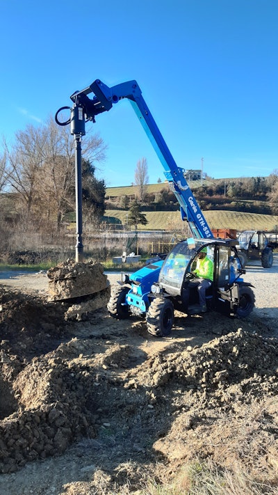 An auger attachment on a telehandler is ideal if you need to work across a ditch to drill.