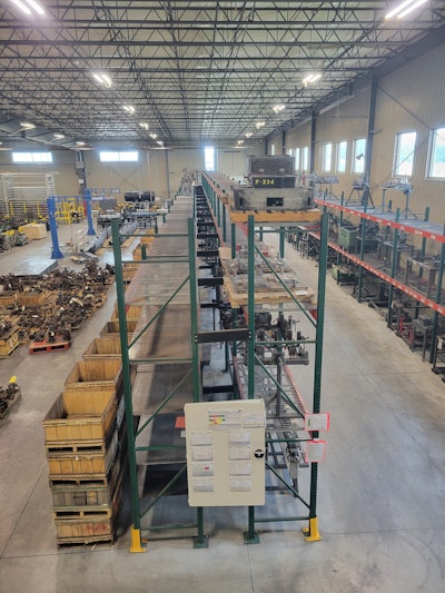 Empty racking within Amerequip's fabrication shop, taken summer 2024 after employing 'The Toyota Way.' Shows the ability to reclaim manufacturing space when changing our driving KPIs from absorption to quality, on-time delivery, and productivity. This space previously held unneeded fixtures and materials and is now being reclaimed and transitioned to value-added workspace.