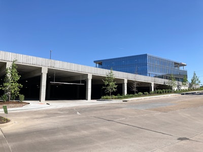 Tarlton self-performed all concrete work on the adjacent 82,000-square-foot parking garage for First Bank. The new garage offers 295 spaces for employees, customers and visitors. Photo courtesy of Tarlton Corp.