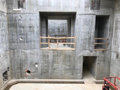 An interior view of mass concrete vault walls that illustrate the complexity of concrete construction.