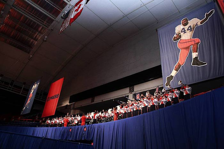 The Syracuse University marching band played the fight song for the football-friendly crowd.