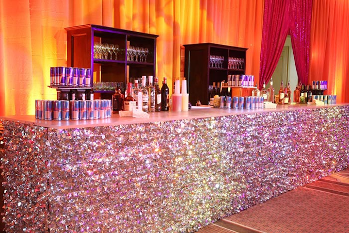 A silver confetti-covered bar served as the focal point of the V.I.P. area.