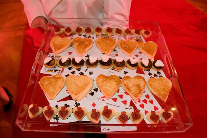 During the reception at the Washington Ballet gala, waiters served tea sandwiches shaped like hearts, spades, and diamonds from Susan Gage Caterers on trays lined with playing cards.