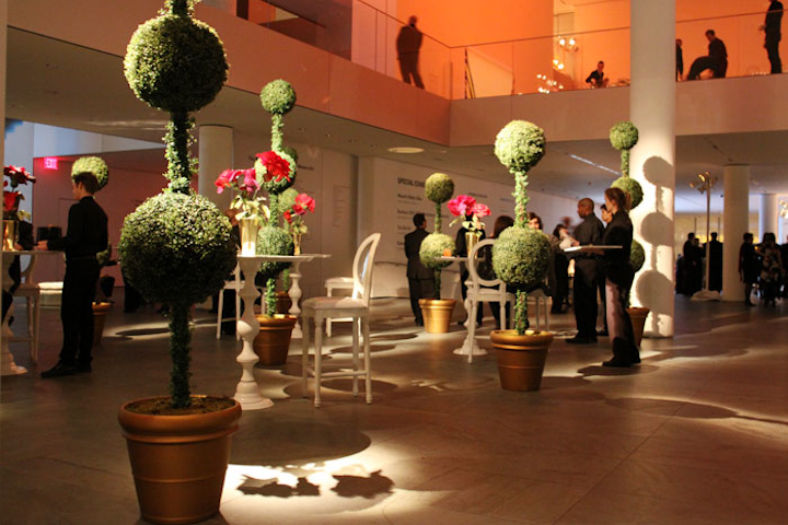 At MoMa’s annual film benefit in November 2009, the museum kicked off an exhibition of Tim Burton's work with decor inspired by his movies. Inspired by his soon-to-be-released film Alice in Wonderland, the lobby was filled with topiaries, large paper flowers, and whimsical white chairs designed by event producers Spec Entertainment.