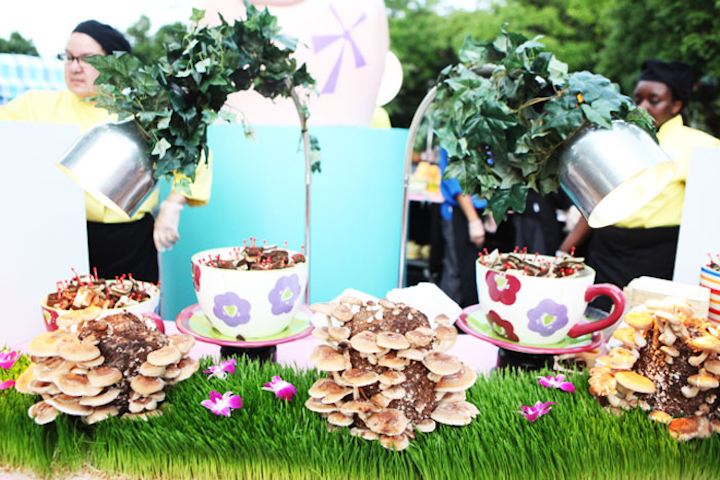 Also at the International Pow Wow, Alice in Wonderland-style teacups served as food displays. Light bites included finger sandwiches on skewers.