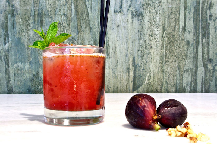 Fig & Olive, which has locations in New York, Los Angeles, and Chicago, has a 'Walnut Julep' on its cocktail list. The ruby-red cocktail contains bourbon, St. Germain liqueur, port, muddled black mission figs, mint, and fresh citrus; it is garnished with shaved walnuts.