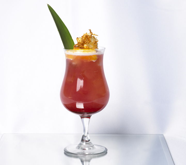 There's also a unique garnish on the tropical-style 'Toronto Sunset' cocktail. Containing grenadine, vodka, Malibu rum, and cranberry and pineapple juices, the festive drink is topped with a pineapple wheel and toasted coconut.